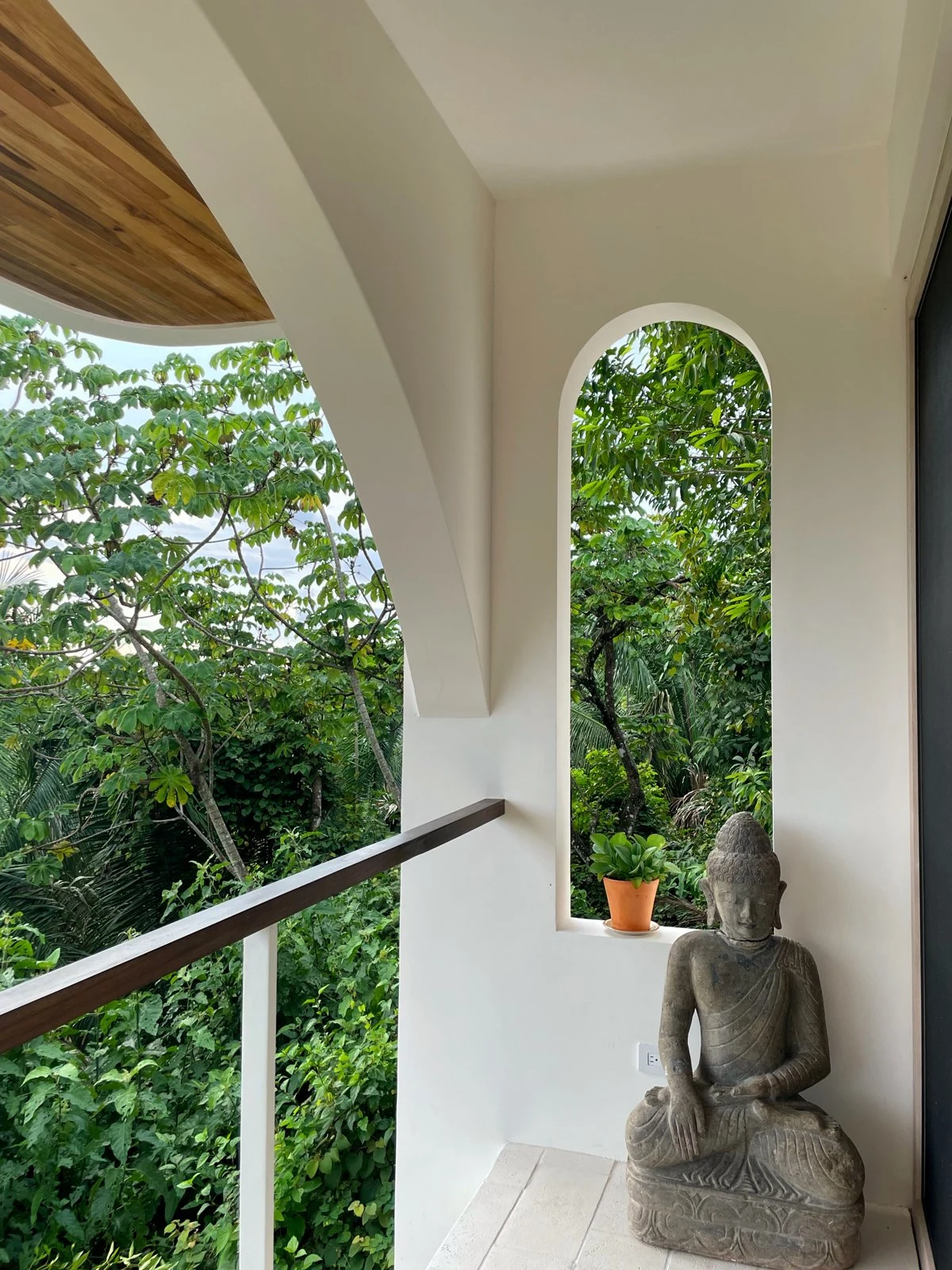 Stone sculpture on a terrace open to the forest
