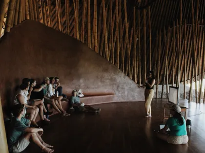 Group gathered inside a bamboo dome