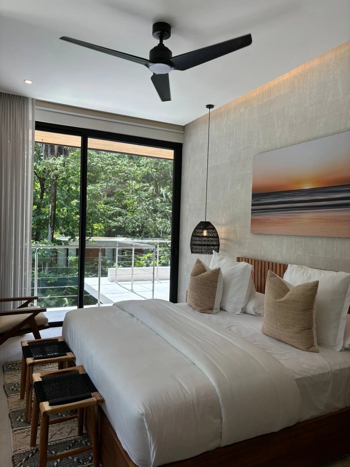 Finished bedroom with a forest view
