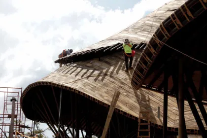 Team working on a curved roof structure