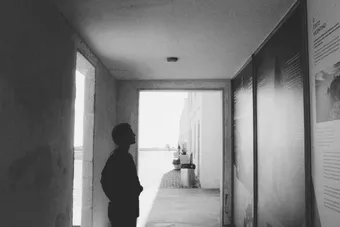 Silhouette of a person in a corridor, black and white