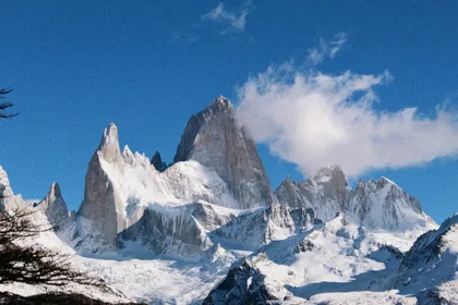 Snowy mountains under a blue sky